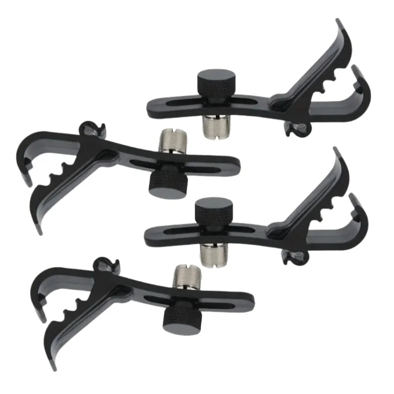 Four black adjustable drum rim microphone clamps with silver threaded mounts.